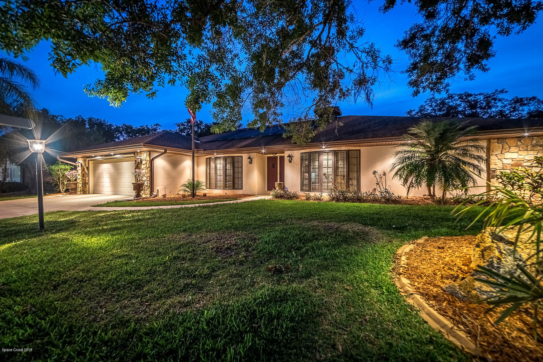 1401 Meadowbrook Road Northeast Palm Bay, FL 32905 - Photo 37 of 46 a view of a house with a big yard