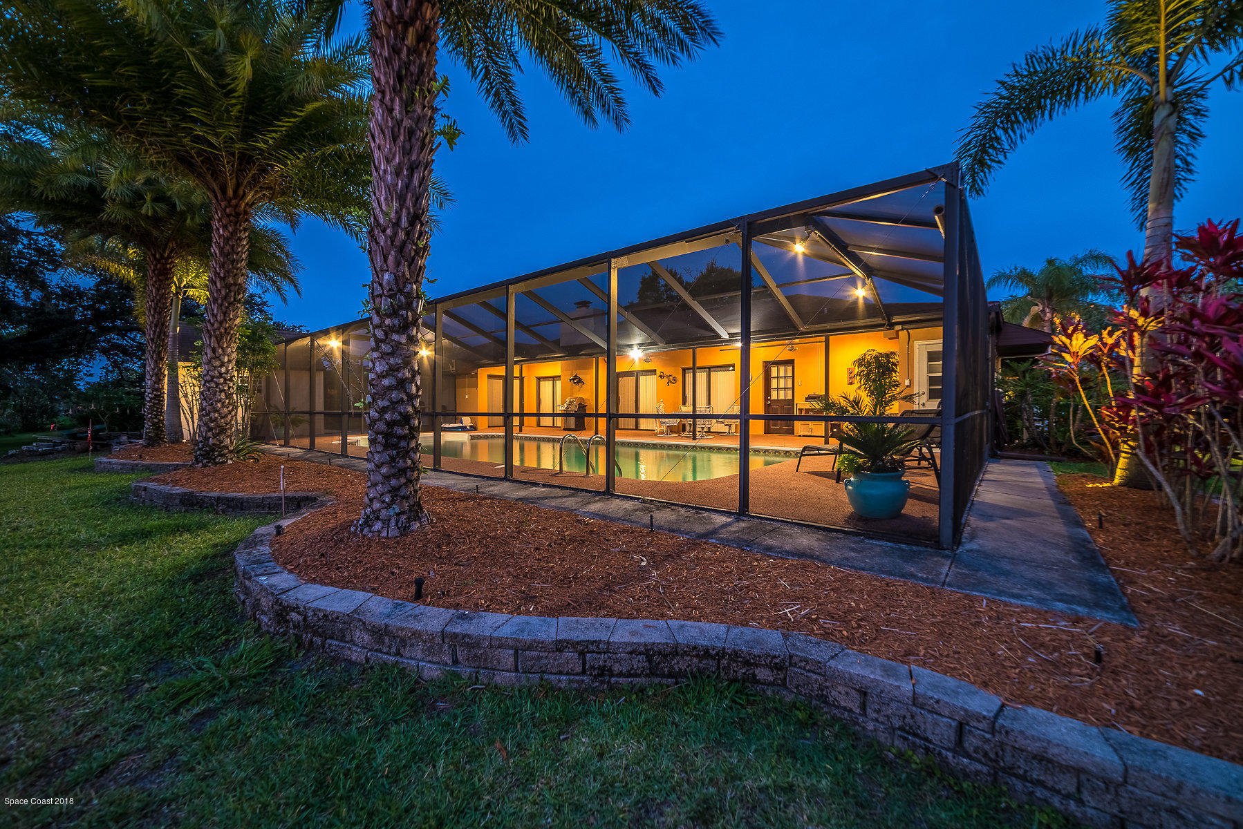 1401 Meadowbrook Road Northeast Palm Bay, FL 32905 - Photo 41 of 46 a view of a backyard with a garden