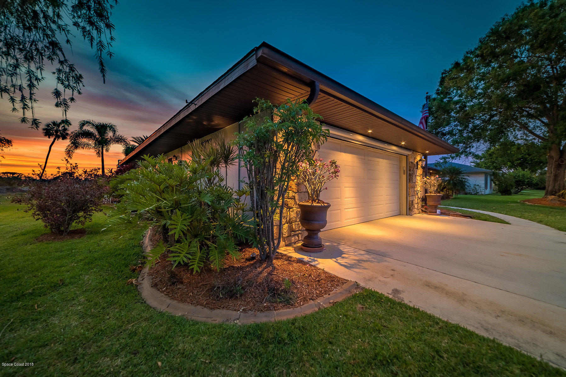 1401 Meadowbrook Road Northeast Palm Bay, FL 32905 - Photo 44 of 46 a front view of a house with a yard