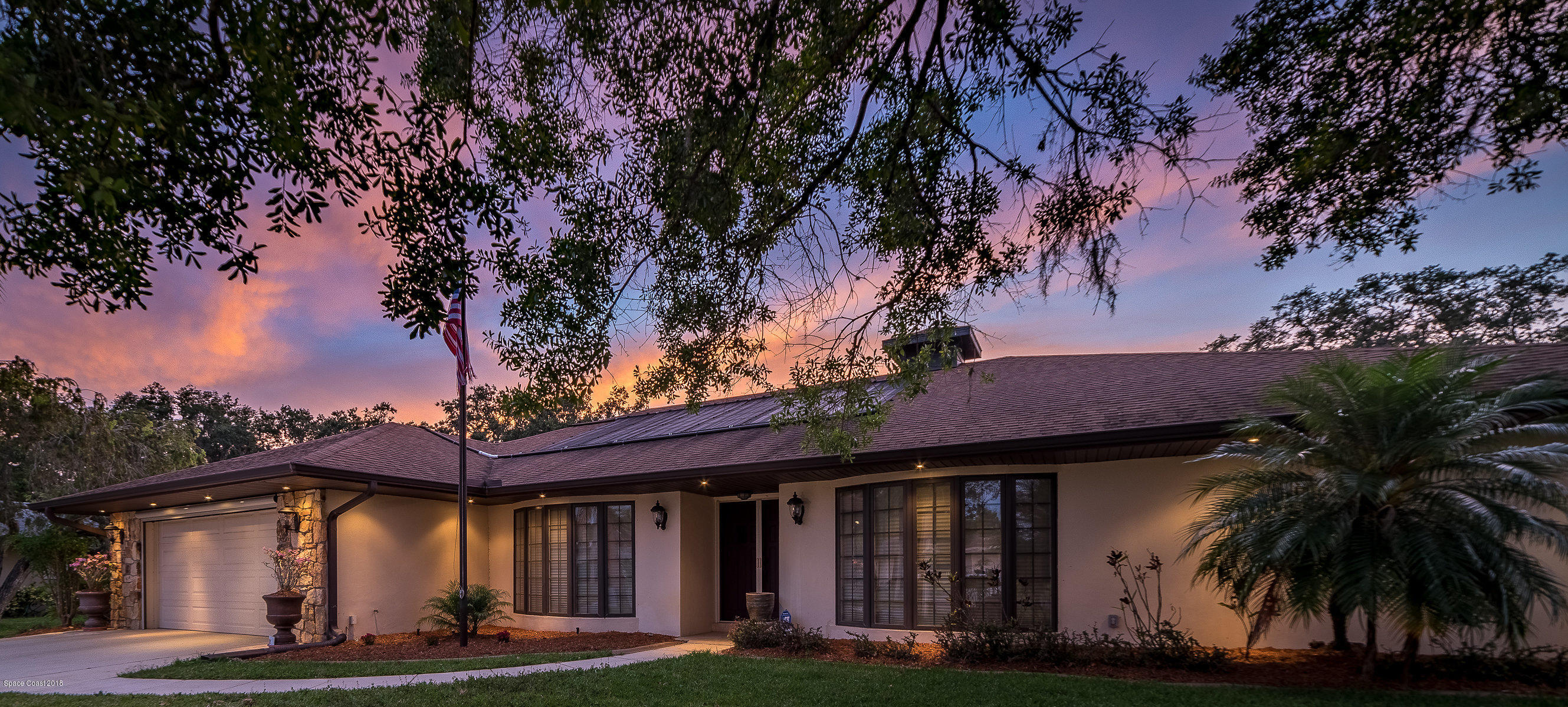 1401 Meadowbrook Road Northeast Palm Bay, FL 32905 - Photo 46 of 46 a front view of a house with garden