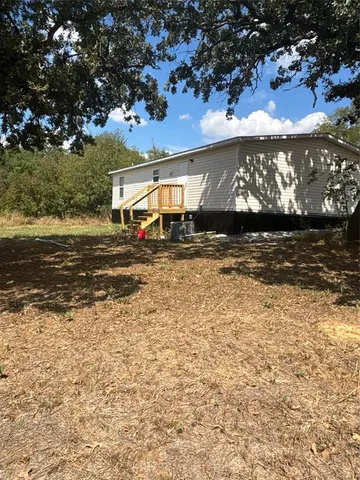 a view of a street with a building in the background