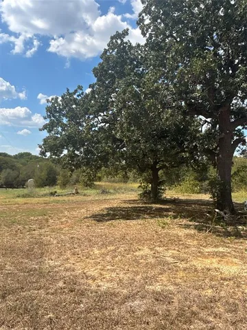 a view of a yard with an outdoor space