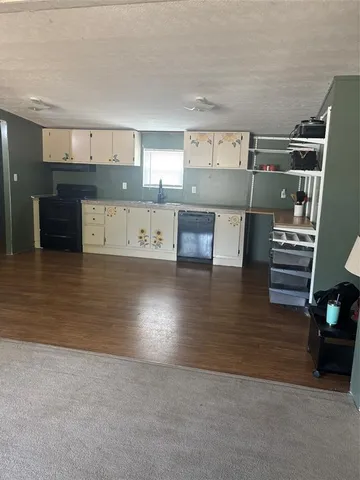 a view of kitchen with cabinets