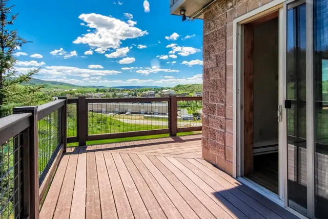 a view of outdoor space with deck and wooden floor