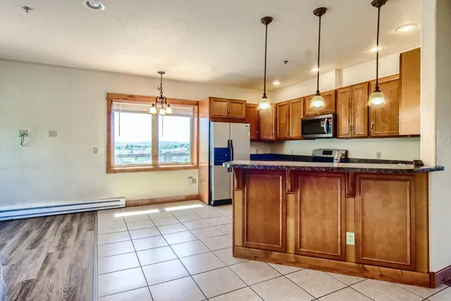 a view of a kitchen with furniture and window