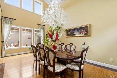 a view of a dining room with furniture and chandelier