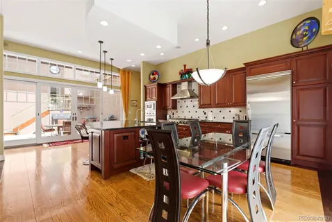 a view of a dining room with furniture window and wooden floor