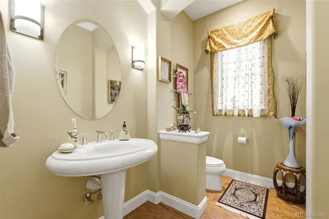 a bathroom with a sink a mirror and a toilet