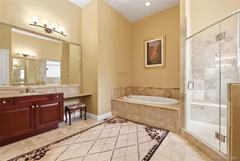 a bathroom with a bathtub sink and a toilet