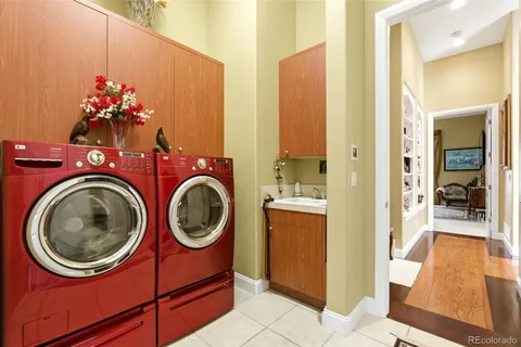 a view of a hallway with washer and dryer