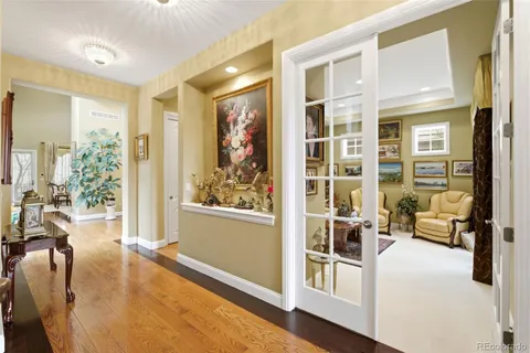 a living room with furniture window and wooden floor
