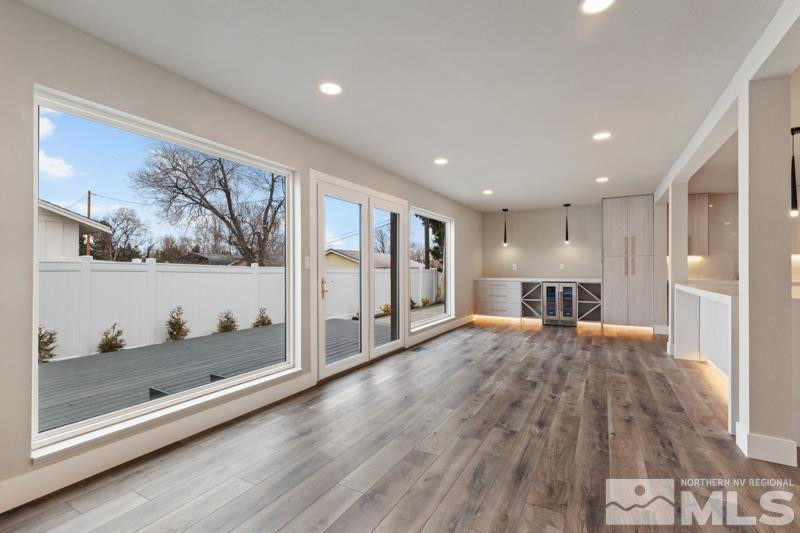 995 Skyline Boulevard Reno, NV 89509 - Photo 16 of 34 a open kitchen with wooden floor and large window