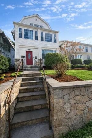 a front view of a house with a yard