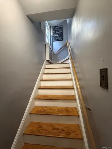 a bedroom with a bed a mirror and a desk