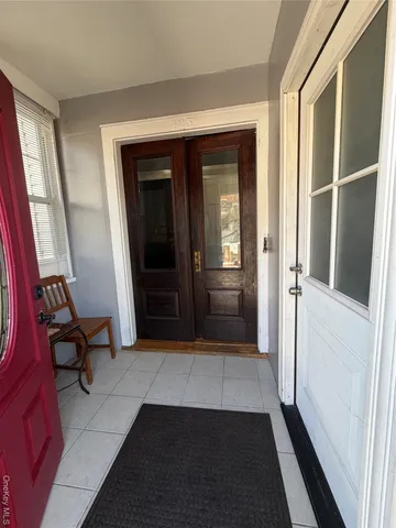 a view of a hallway with furniture and closet