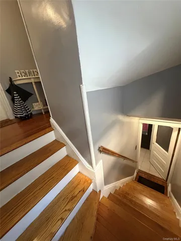 a view of staircase with white walls