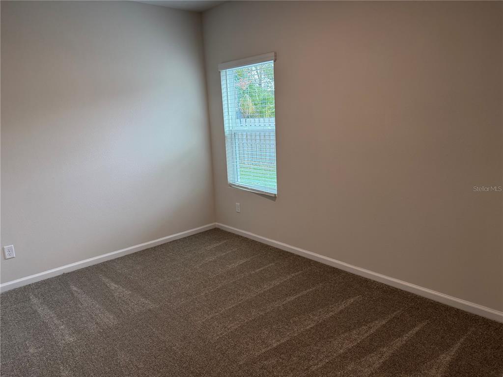 9 Pier Lane Palm Coast, FL 32164 - Photo 6 of 17 an empty room with a window