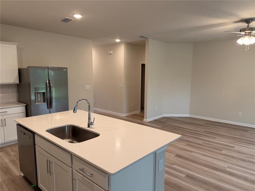 9 Pier Lane Palm Coast, FL 32164 - Photo 9 of 17 a kitchen with stainless steel appliances granite countertop a sink and a refrigerator