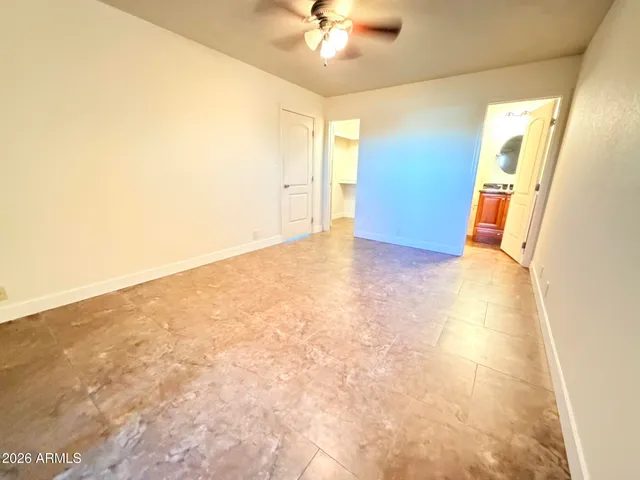 a view of livingroom with window and a ceiling fan