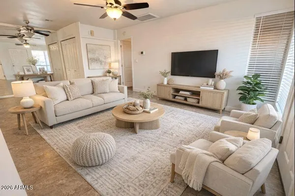 a living room with furniture and a flat screen tv