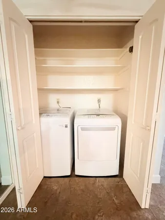 a utility room with dryer and washer