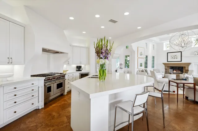 a large spacious bathroom with a sink a large mirror and a bathtub