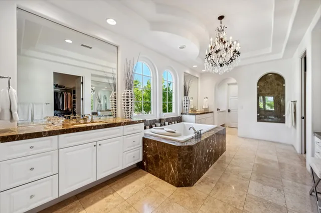 a kitchen with granite countertop a sink and a stove top oven