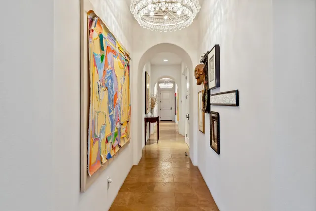 a living room with furniture a flat screen tv and a window