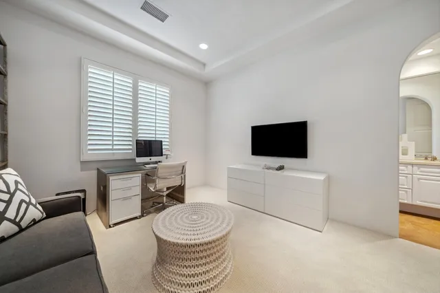a kitchen with granite countertop white cabinets and stainless steel appliances