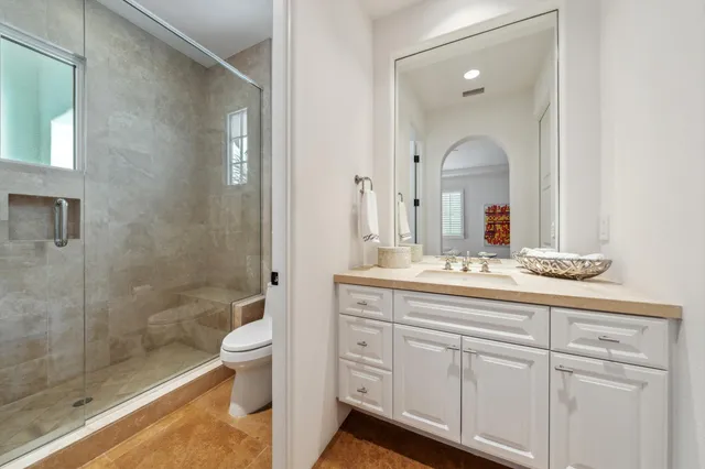 an aerial view of a house with swimming pool patio and lake view