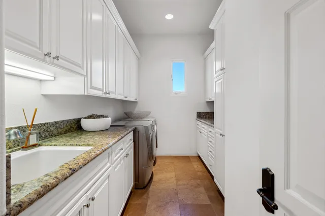 a view of a house with swimming pool and sitting area