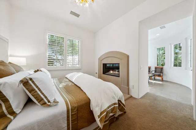 a view of a swimming pool and lounge chairs
