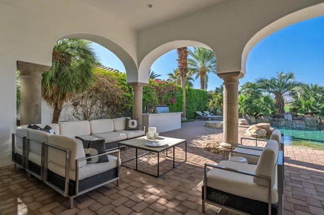 a view of a house with a yard and a swimming pool