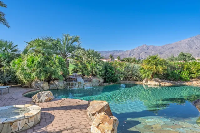 a view of a mountain with a swimming pool