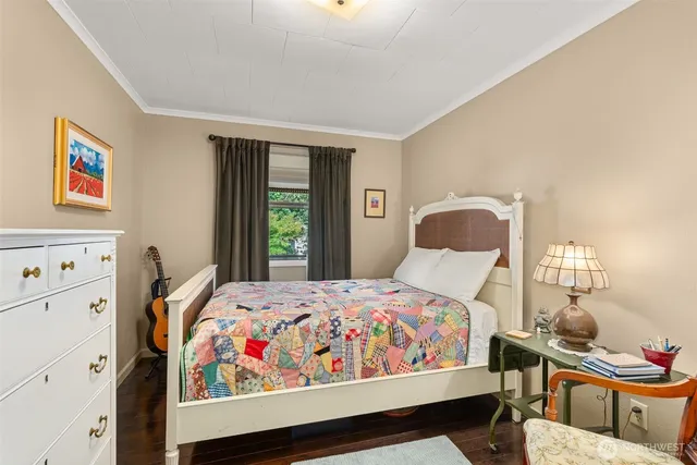 a bedroom with furniture and windows