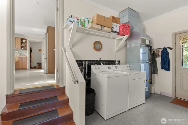 a utility room with dryer and washer