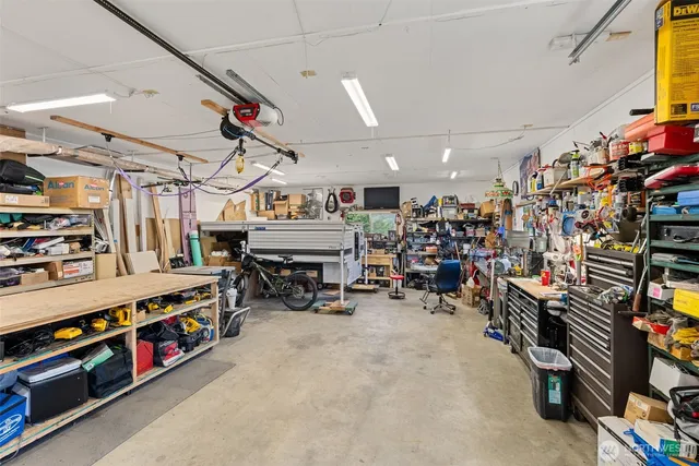 a view of a house with a yard and plants