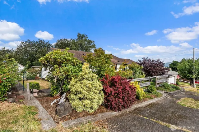 a view of a chairs and table in a yard