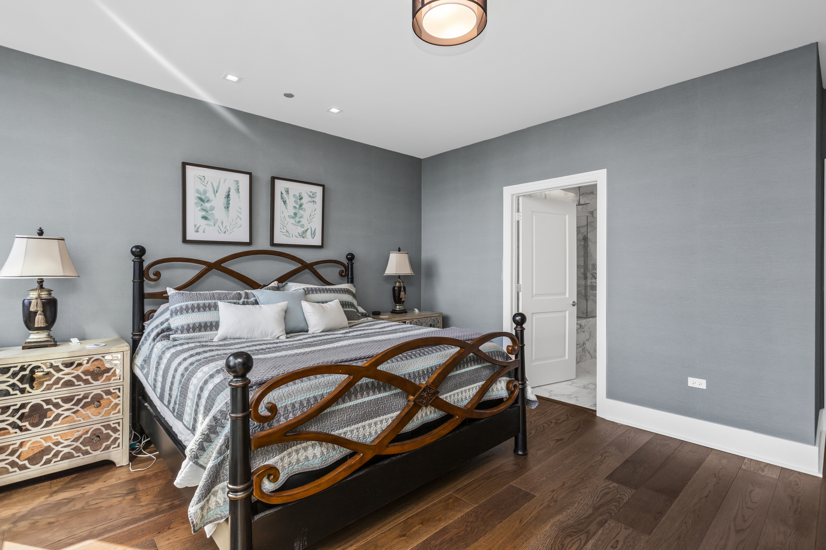 363 East Wacker Drive, Unit 2503 Chicago, IL 60601 - Photo 15 of 52 a bedroom with a bed and a lamp