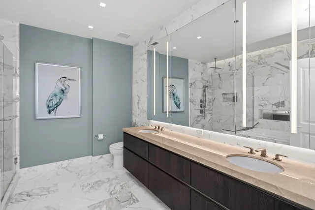 a bedroom with a large bed and a large window