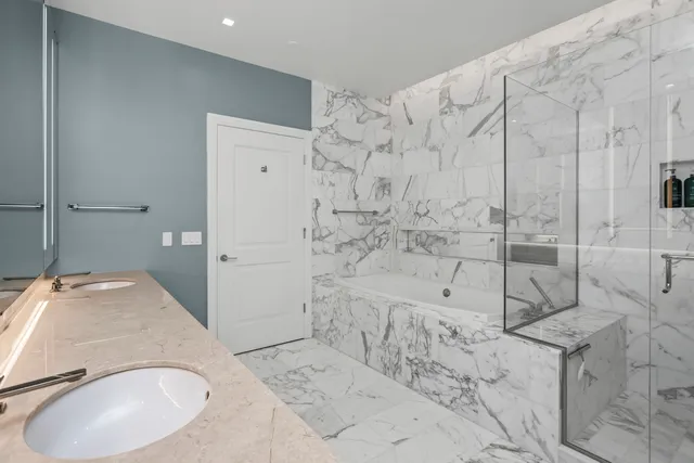 a bedroom with a bed and a lamp