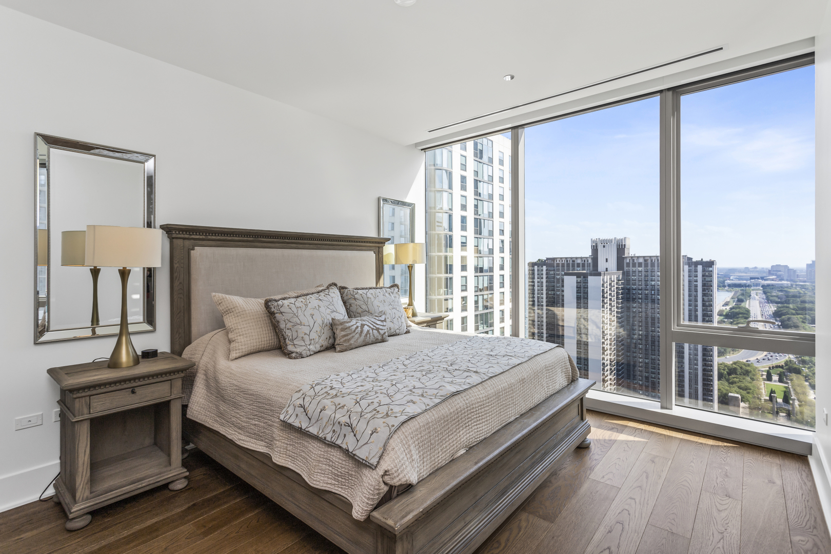 363 East Wacker Drive, Unit 2503 Chicago, IL 60601 - Photo 18 of 52 a bedroom with a large bed and a large window