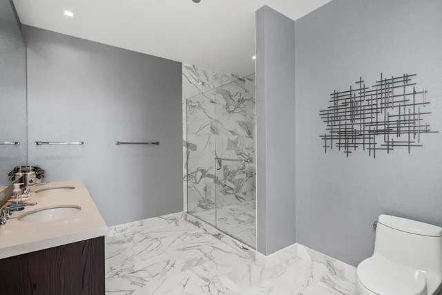 a bedroom with a large bed and a large window