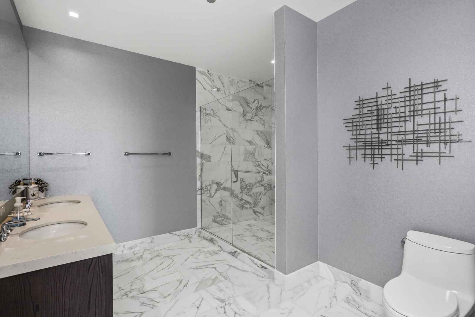 363 East Wacker Drive, Unit 2503 Chicago, IL 60601 - Photo 20 of 52 a bathroom with a sink toilet and shower