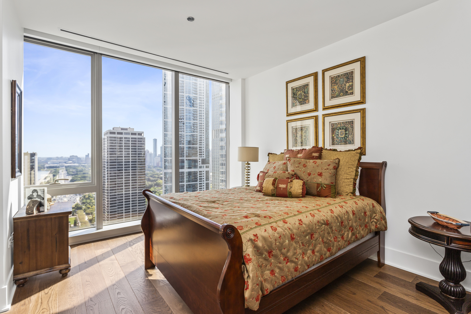 363 East Wacker Drive, Unit 2503 Chicago, IL 60601 - Photo 22 of 52 a bedroom with a large bed and a large window