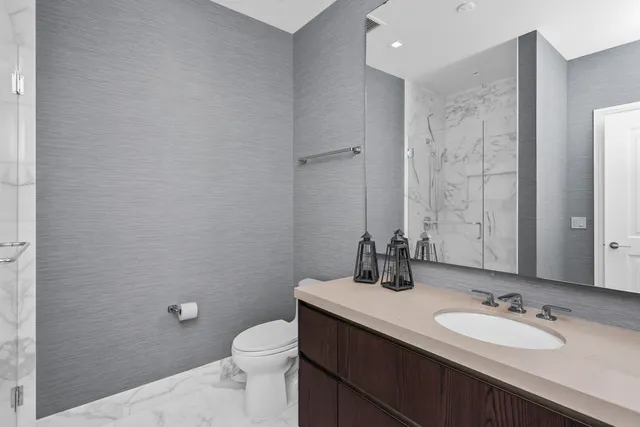 a bedroom with two beds and a fireplace