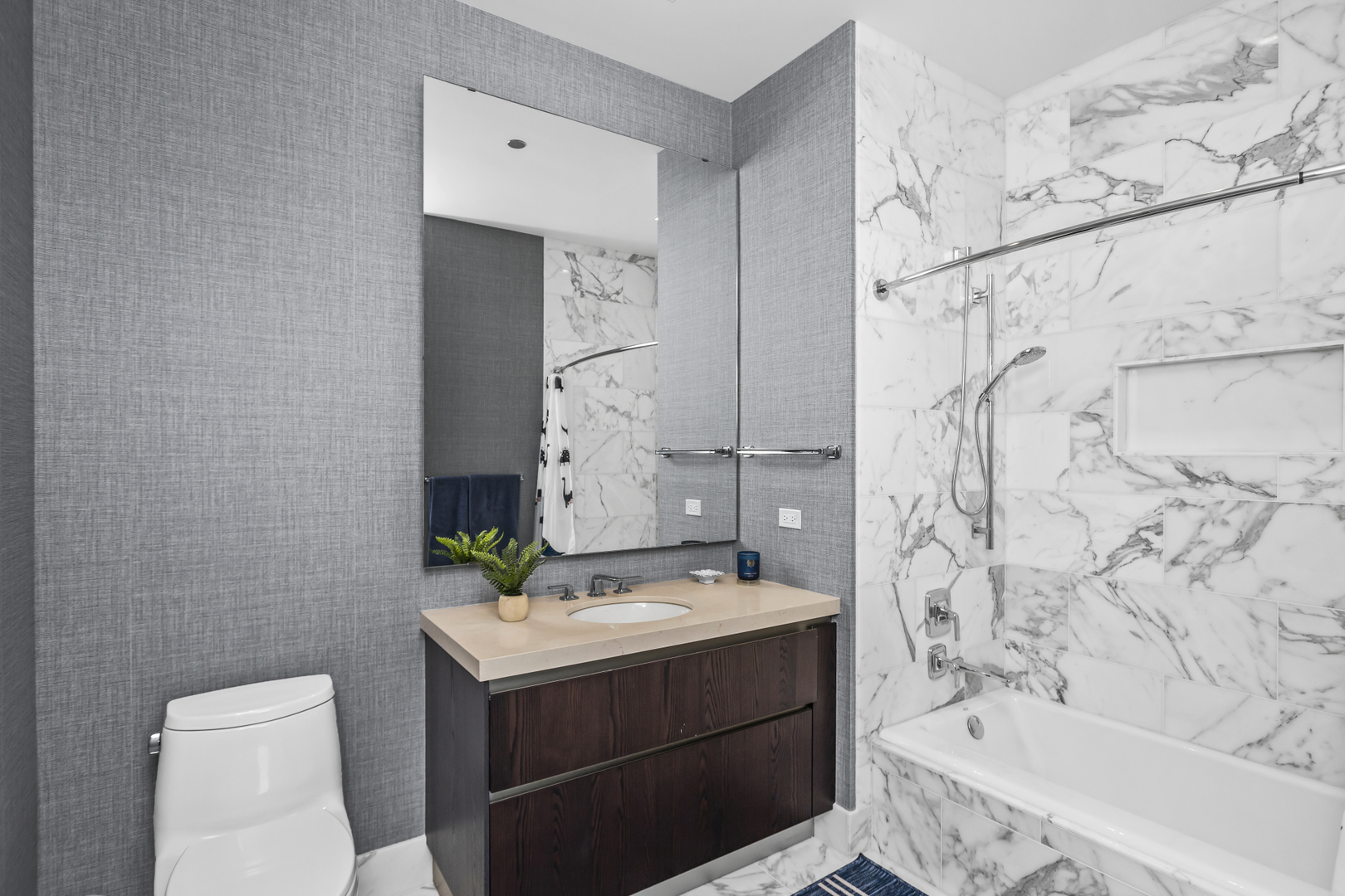 363 East Wacker Drive, Unit 2503 Chicago, IL 60601 - Photo 27 of 52 a bathroom with a sink mirror toilet and bathtub