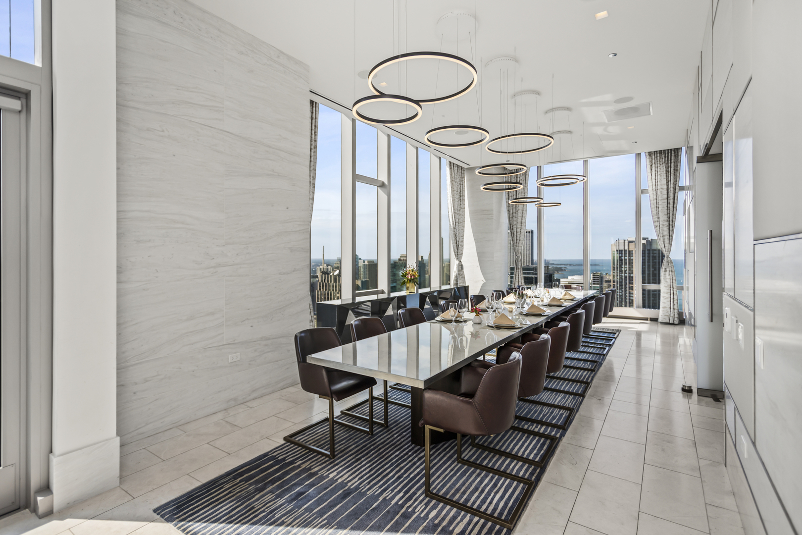 363 East Wacker Drive, Unit 2503 Chicago, IL 60601 - Photo 40 of 52 a large white kitchen with a large window and stainless steel appliances
