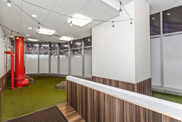 a view of balcony with furniture and wooden floor