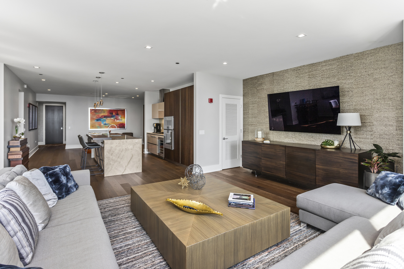 363 East Wacker Drive, Unit 2503 Chicago, IL 60601 - Photo 7 of 52 a living room with furniture and a flat screen tv